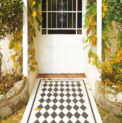 Front garden design with Victorian-style St Andrews Black and Dover White tiles stocked by Hyperion Tiles