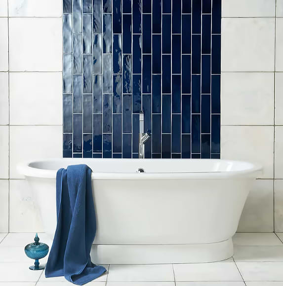 Blue bathroom tiles in a modern bathroom stocked by Hyperion Tiles
