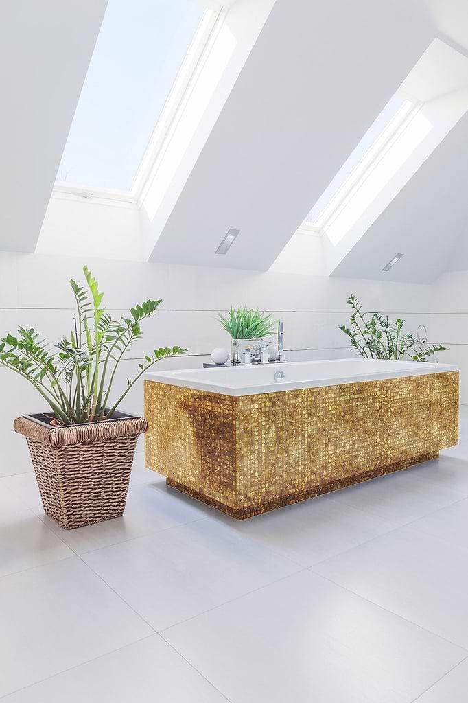 Suitable for statement baths, the Siminetti Emerald Gold collection stocked by Hyperion Tiles