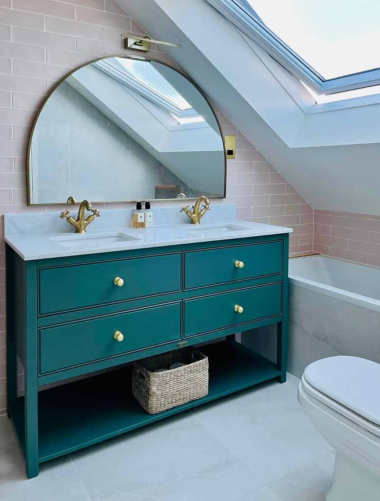 The new vanity is painted green for contrast in home renovation