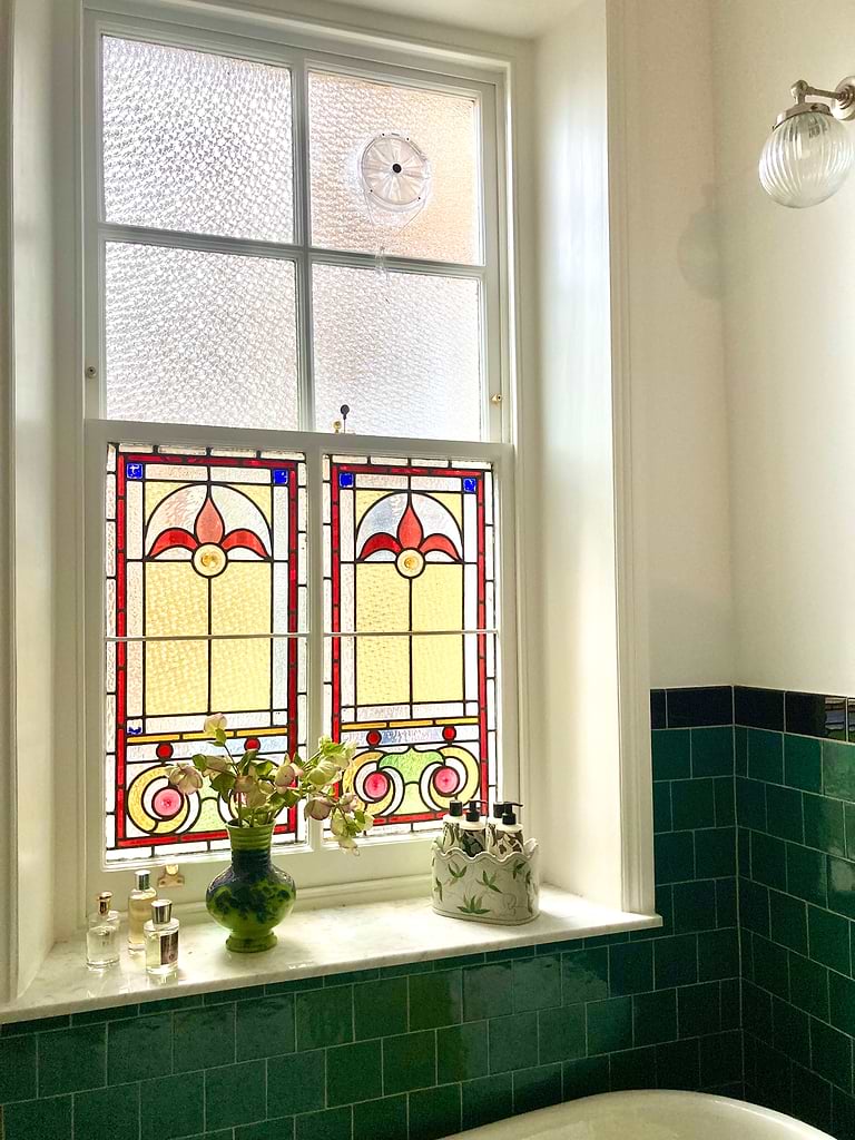 Stained glass window in period-style bathing retreat