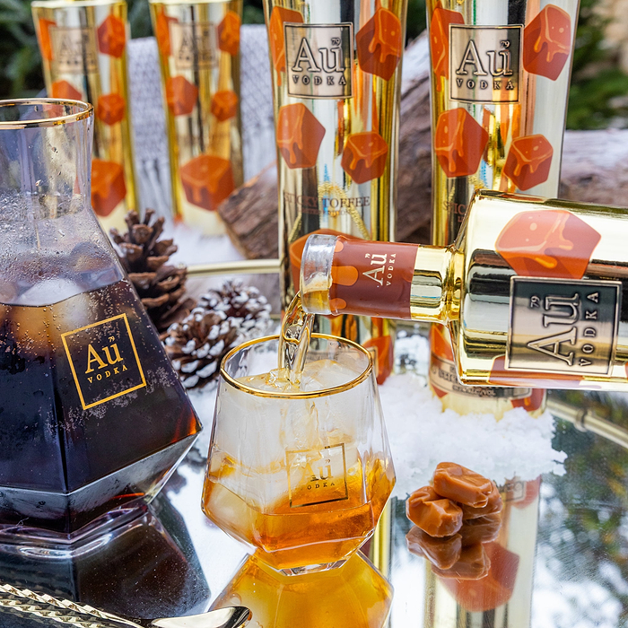 Au Sticky Toffee Vodka being poured into a Au Vodka Glass