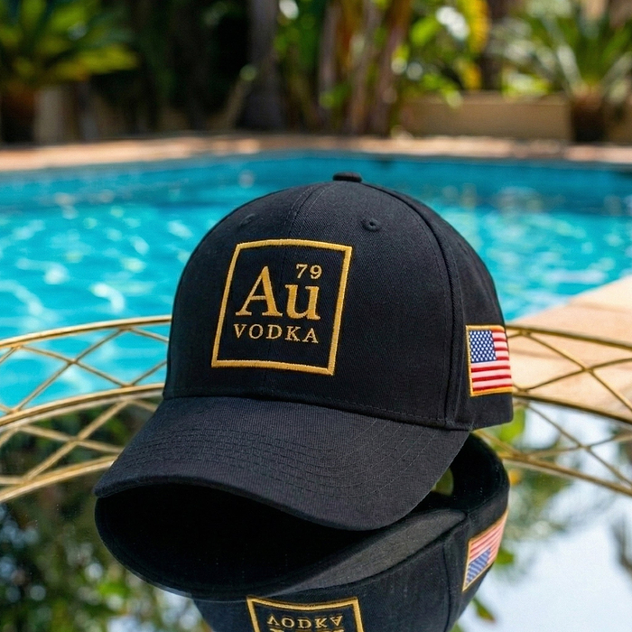 Au Vodka USA black baseball cap with gold Au Vodka logo and American flag patch