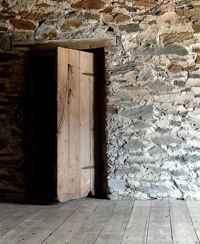 Wooden doorway and brick wall