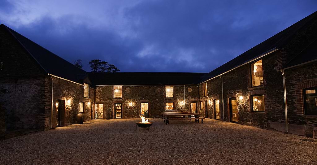Evening outdoor courtyard Nkuku barns with fire pit