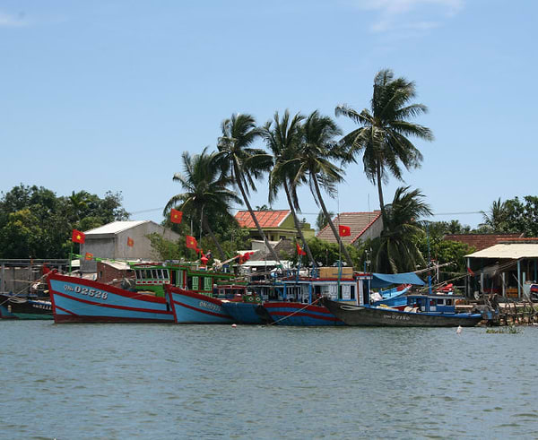 Vietnamese riverside setting with boats