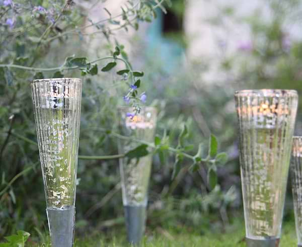 Silver garden lanterns in the ground