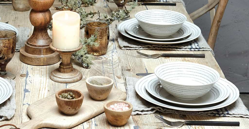 full scene of food, cutlery and plates laid on table