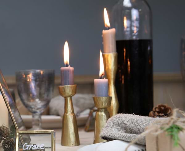 Christmas table scene with brass candlesticks