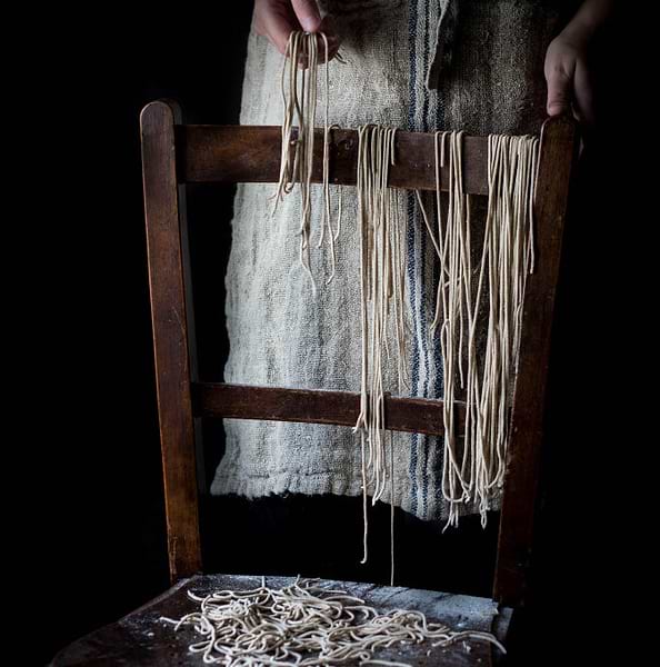 Homemade soba noodles hanging on a chair
