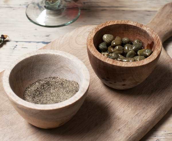 spices and olives in wooden bowl