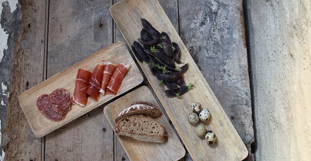 Wooden platters with antipasti