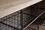 Close-up of the nkuku Abha Reclaimed Wood & Iron Storage Bench - Natural, highlighting the textured wood tabletop and the metal grid shelves beneath, ideal for use as a shoe storage bench or entryway organizer.