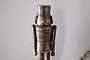 The Imay Nutcracker - Antique Brass by nkuku features a wooden soldier with a cylindrical hat, round eyes, and a mustache in a detailed uniform—ideal for festive styling or as part of your decorative nutcracker display.