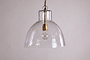 The Inayah Recycled Glass Pendant - Clear by nkuku features a wide, textured glass dome shade suspended by a chain, with a gold-toned socket visible inside, set against a plain, light background.