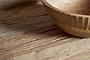 A close-up of the nkuku Ibo Reclaimed Wood Pantry Standing Shelves in Natural, with soft lighting highlighting the unique grain—ideal for styling open shelving or enhancing your kitchen console with a rustic touch.