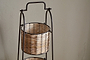 The nkuku Montali Iron & Rattan Three-Tiered Storage Stand - Natural features a handwoven wire and rattan design with a sturdy metal frame, making it perfect for organizing your kitchen or pantry.