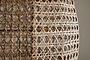 Close-up of the nkuku Shawa Rattan Lampshade – Natural, showcasing its handwoven diamond and crisscross pattern. The interlaced rattan strips create an airy, geometric texture as soft light shines through this beautiful woven piece.