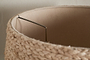 Close-up of the top edge of the nkuku Pisang Natural Lampshade, featuring an organic woven texture. The light beige fabric lining and metal frame inside are visible against an off-white wall.