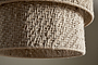 Close-up of the nkuku Thimba Woven Jute Chandelier in Natural, featuring a textured jute shade with intersecting fibers. The rustic weave allows gentle light to filter through, highlighting its organic charm.