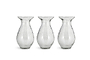 The nkuku Bapti Bud Vases – Clear (Set of 3) feature wide flared rims, narrow necks, and bulbous bodies with a textured, wavy finish. Arranged side by side, they reflect light beautifully against a plain white background.