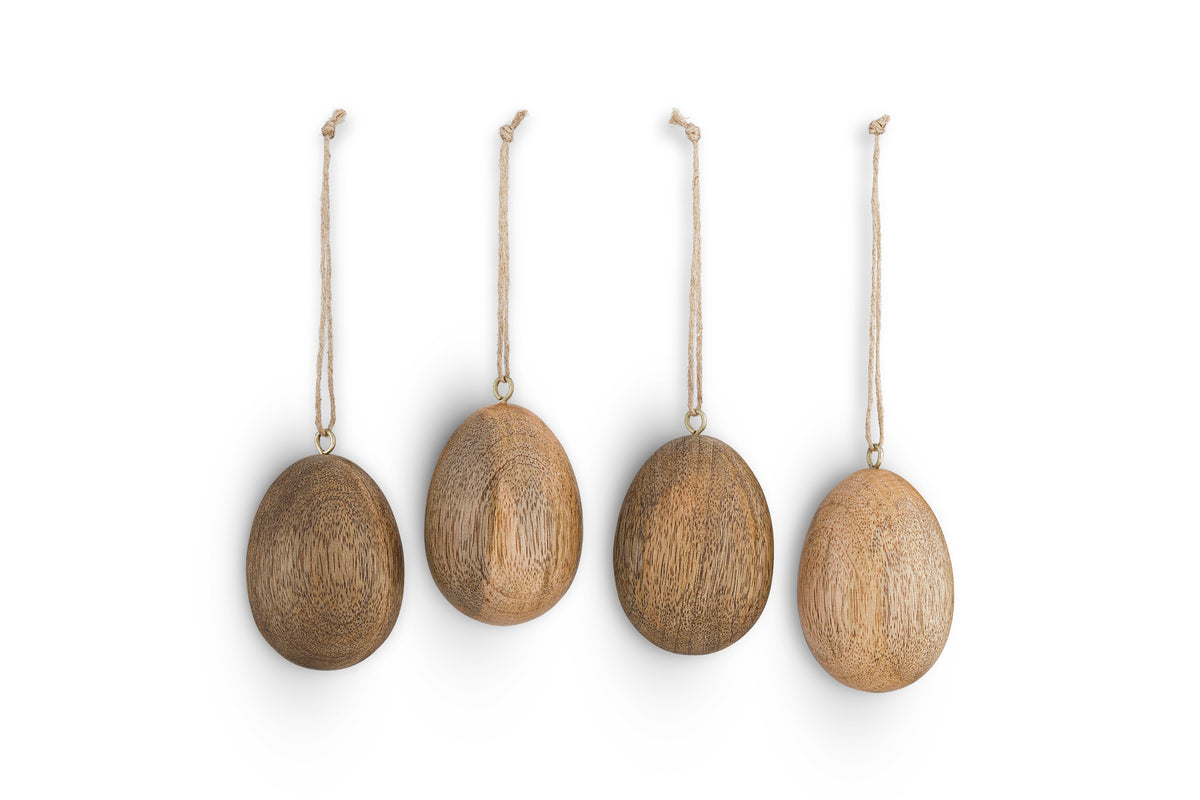 The nkuku Dima Mango Wood Hanging Egg Decoration set includes 4 natural ornaments, each displaying unique wood grain. Perfect for stylish Easter décor, these smooth eggs hang on string loops and add a rustic touch to your space.