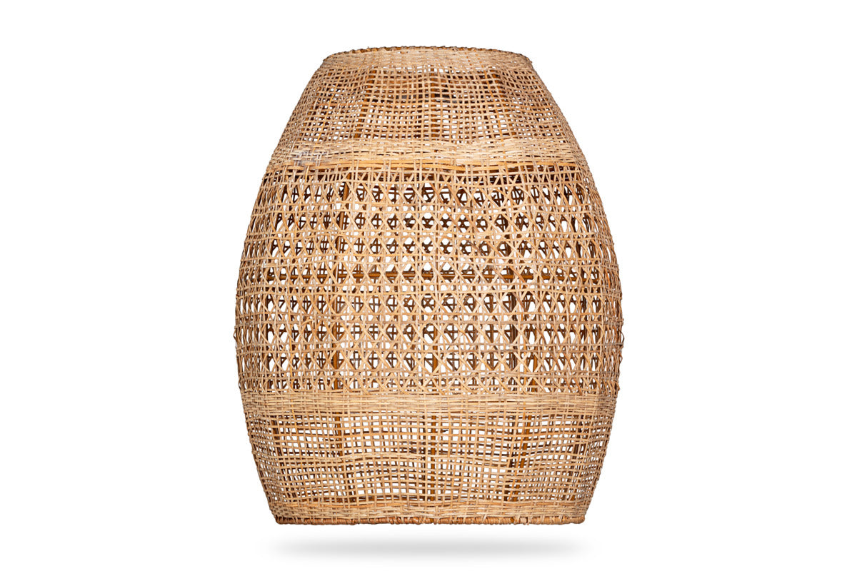 The Shawa Rattan Lampshade - Natural by nkuku features a handwoven, light brown design with a wide round shape and narrow top. Its open weave creates a semi-transparent effect, beautifully displayed against a plain white background.