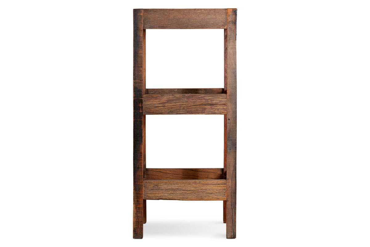 The nkuku Akara Reclaimed Wood Storage Caddy in Natural features three open shelves and a rustic, vintage look with weathered wood and natural imperfections. Its sturdy design stands out against a white background.