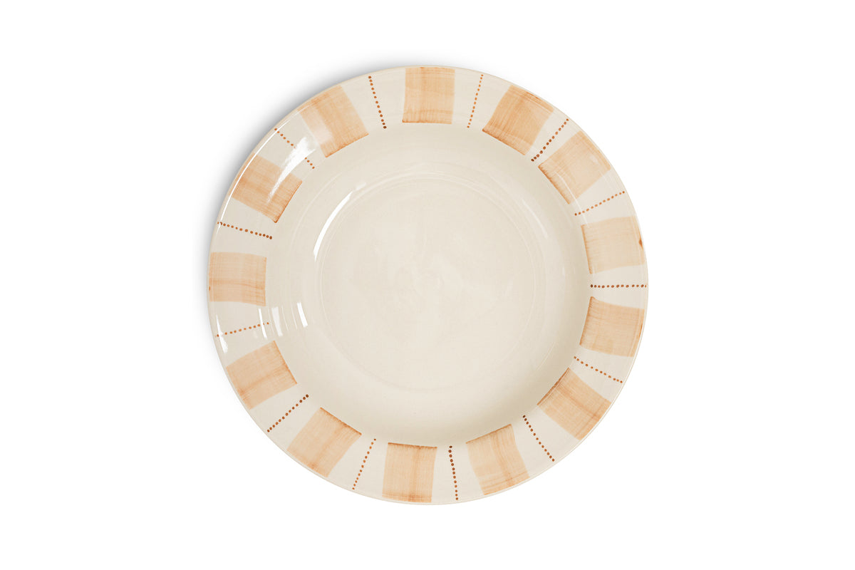 The Patthar Pasta Bowl - Cream & Clay by nkuku is a round, cream ceramic bowl with a wide rim featuring rustic light brown brush strokes and dotted lines, while its glossy center makes it a charming addition to any dinnerware collection.