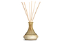 The nkuku Oakmoss & Rose Scented Reed Diffuser features a pear-shaped yellow ceramic vase with a matte finish, filled with light wooden reeds that diffuse a subtle floral fragrance into your space.