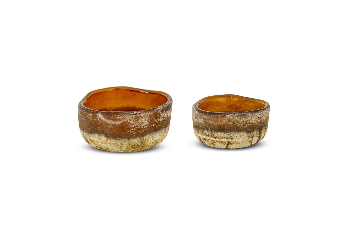 The Janka Tealight Holders - Dark Amber (Set of 2) by nkuku feature rough, uneven edges and earthy brown tones for a rustic, handcrafted look, beautifully set against a plain white background.