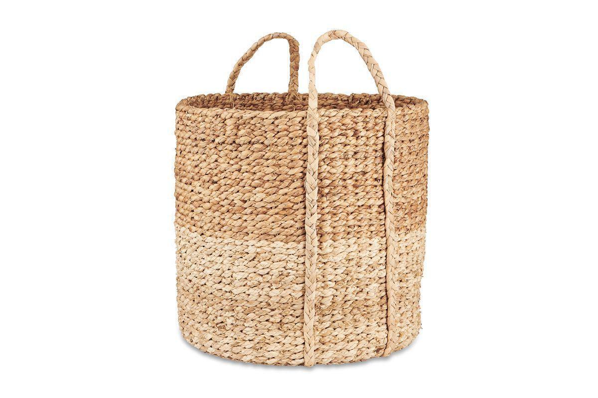 The nkuku Nkomi Basket is a tall, round hand-woven basket with two sturdy handles, featuring natural, light, and medium brown horizontal bands for a rustic look—perfect as stylish storage. Shown on a plain white background.