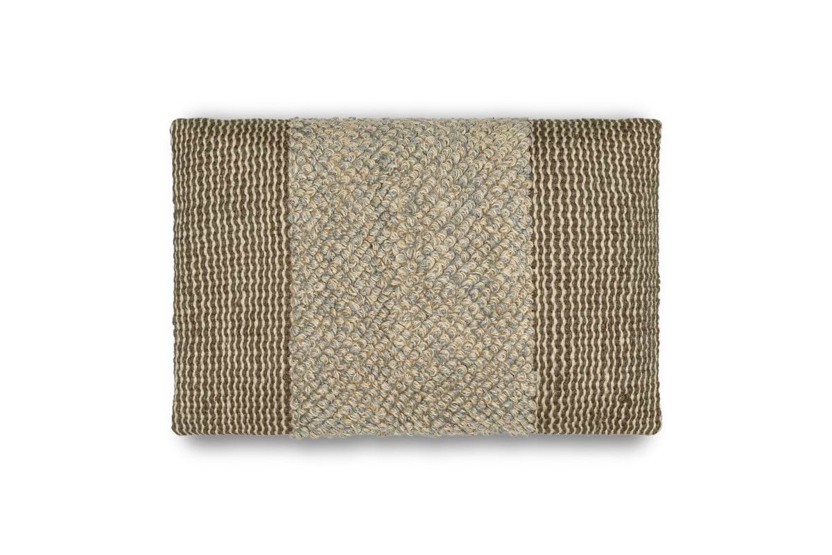 The Paduna Jute & Cotton Cushion Cover by nkuku features a soft blue and brown design with a textured center and ribbed edges made of natural fibers. The cover is displayed on a plain white background.