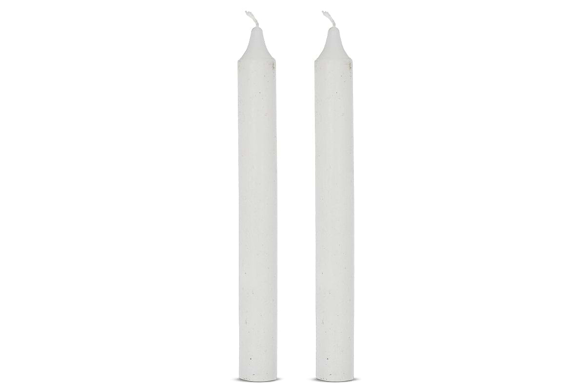 The nkuku Rustic Soy Blend Dinner Candles in white come as a set of 2. Each tall, smooth candle features a pointed tip and short, unlit wick, standing upright side by side against a plain white background.