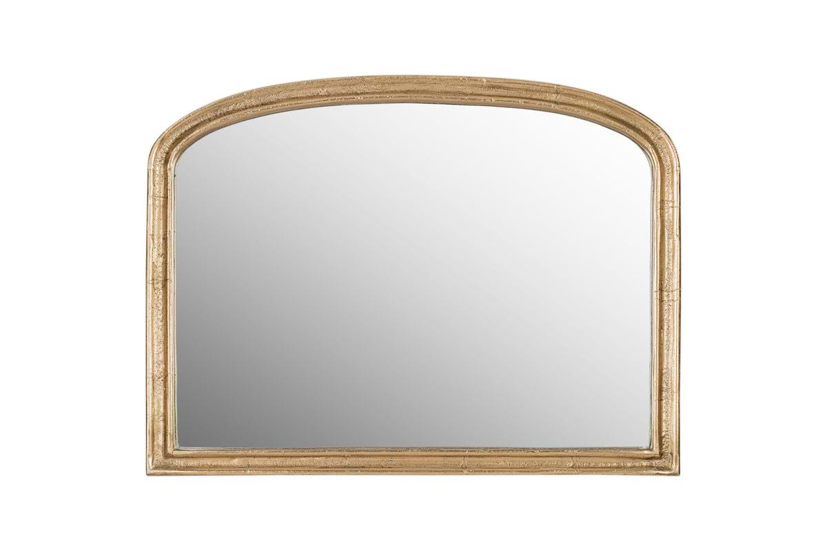 The nkuku Almora Wall Mirror - Extra Small features an antique brass arched frame with a slightly distressed finish, perfect for compact spaces.