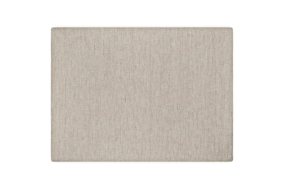 A square beige fabric napkin with fine vertical stripes, echoing the subtle elegance of nkuku’s Borba Hemp & Cotton Housewife Pillowcases in Espresso, is neatly laid flat on a white background.