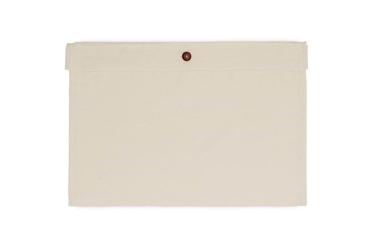 The Cela Hemp & Cotton Fitted Sheet - Natural by nkuku is shown in a beige fabric envelope-style pouch with a flap and brown button closure, evoking premium bedding packaging, set against a white background.