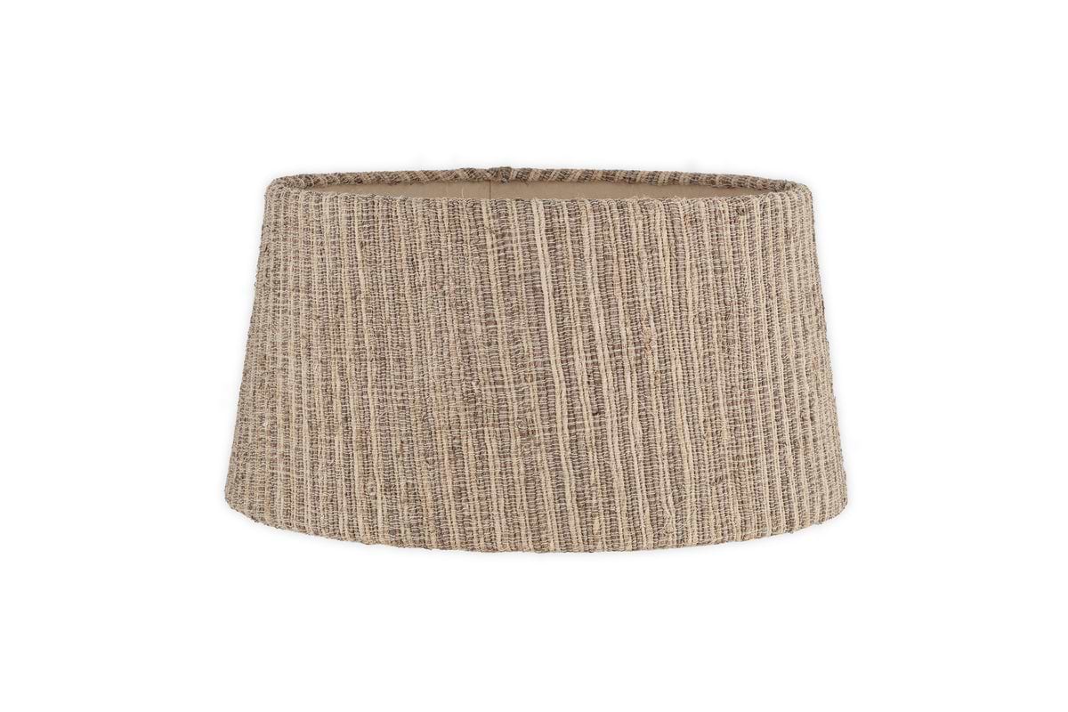 The nkuku Nadee Banana Leaf Lampshade - Natural is a sustainable, beige cylindrical shade with a textured woven pattern and rustic look, shown against a plain white background.