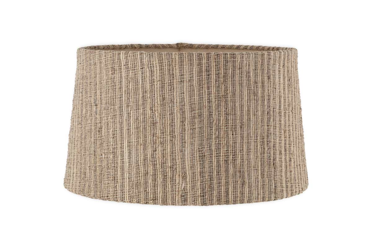 The nkuku Nadee Banana Leaf Lampshade features a cylindrical shape and woven texture in natural light brown tones, offering a timeless style. Shown against a plain white background.