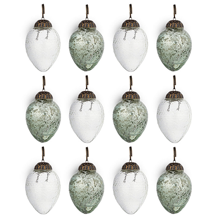 The nkuku Enia Mini Hanging Egg Decoration set includes 12 vintage-style ornaments in antique teal and clear, each with an antique brass cap and brown loop, arranged in a 3x4 grid against a white background.