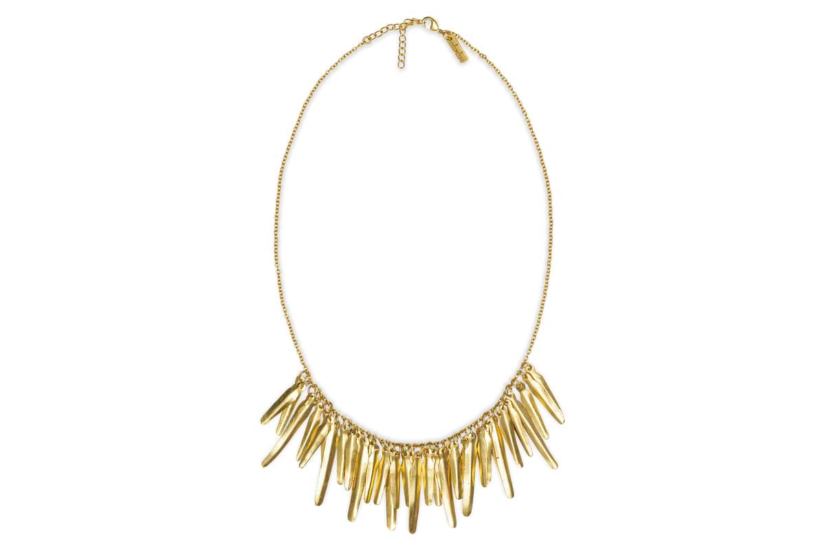 The Omuti Necklace - Gold by nkuku features a delicate gold chain with multiple elongated, pointed pendants in a chic fringe design—an effortlessly stylish piece for any party-ready look.