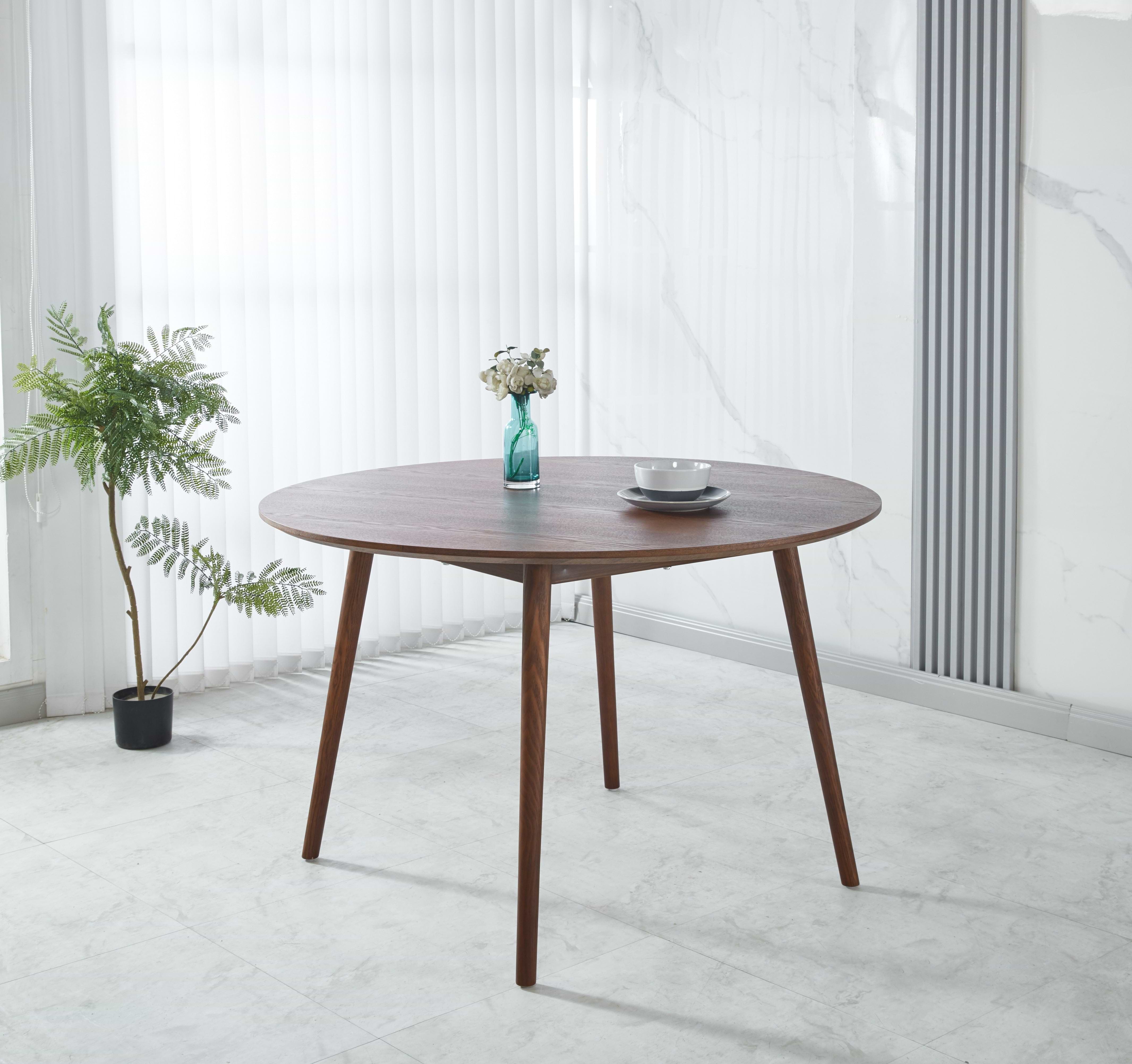 פינת אוכל שולחן עגול צבע עץ אגוז קוטר 120 ס"מ דגם דניאל + 4 כיסאות דמוי עור בשילוב רגל אגוז דגם מודרן