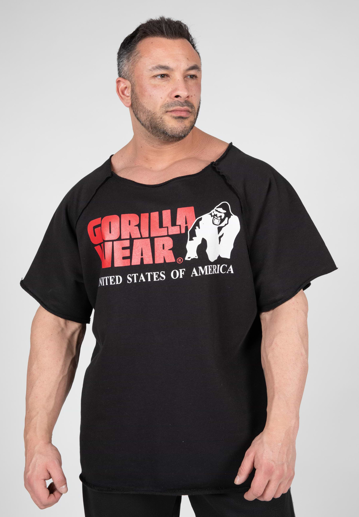 https://sfycdn.speedsize.com/c25f6533-6b88-466f-b868-046faea8c084/https://usa.gorillawear.com/cdn/shop/products/90107900-classic-work-out-top-black.jpg?v=1680004968