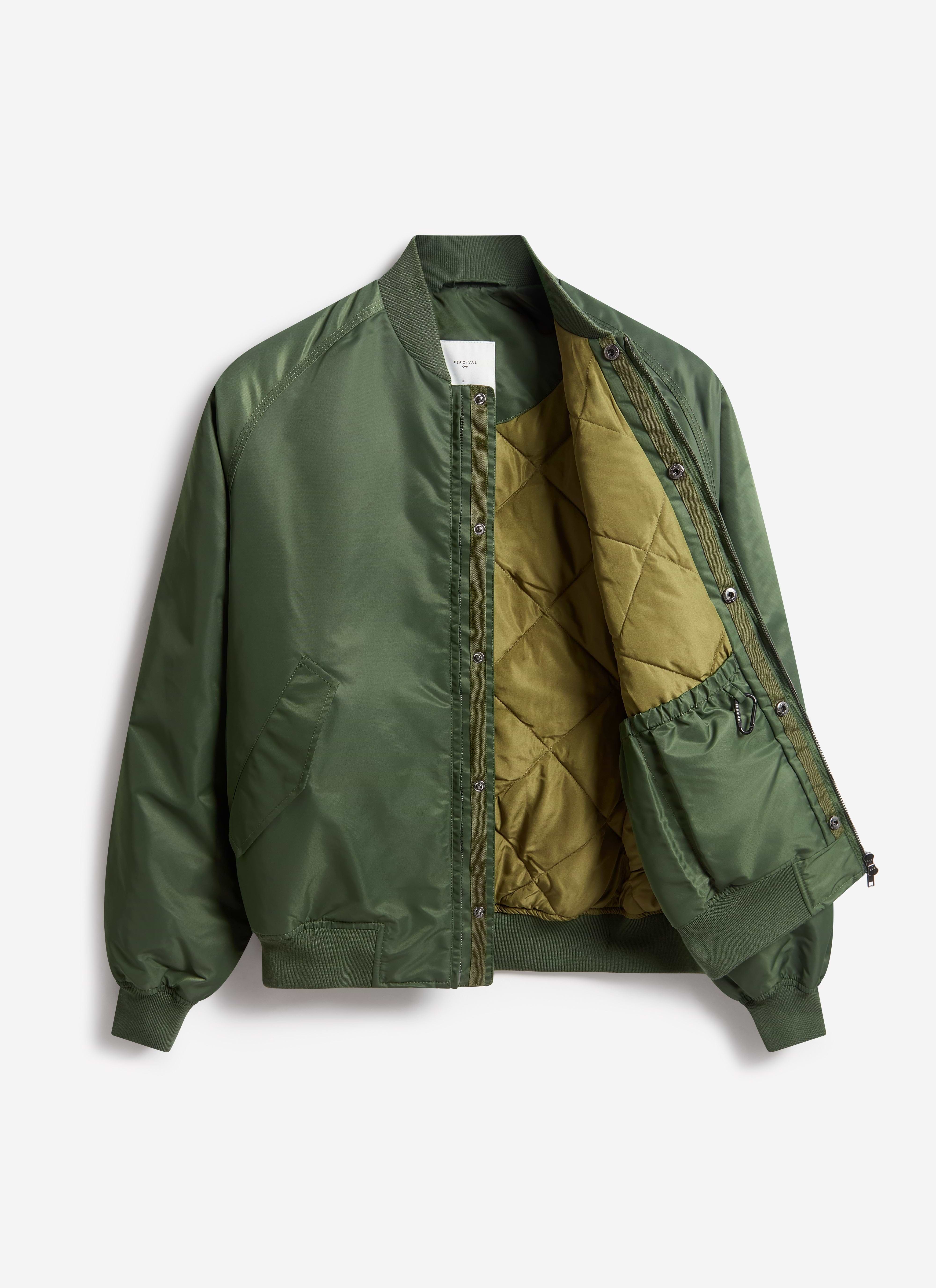 The Percival Nylon Bomber Jacket in forest green, unzipped to reveal the contrast quilted lining and internal pockets.