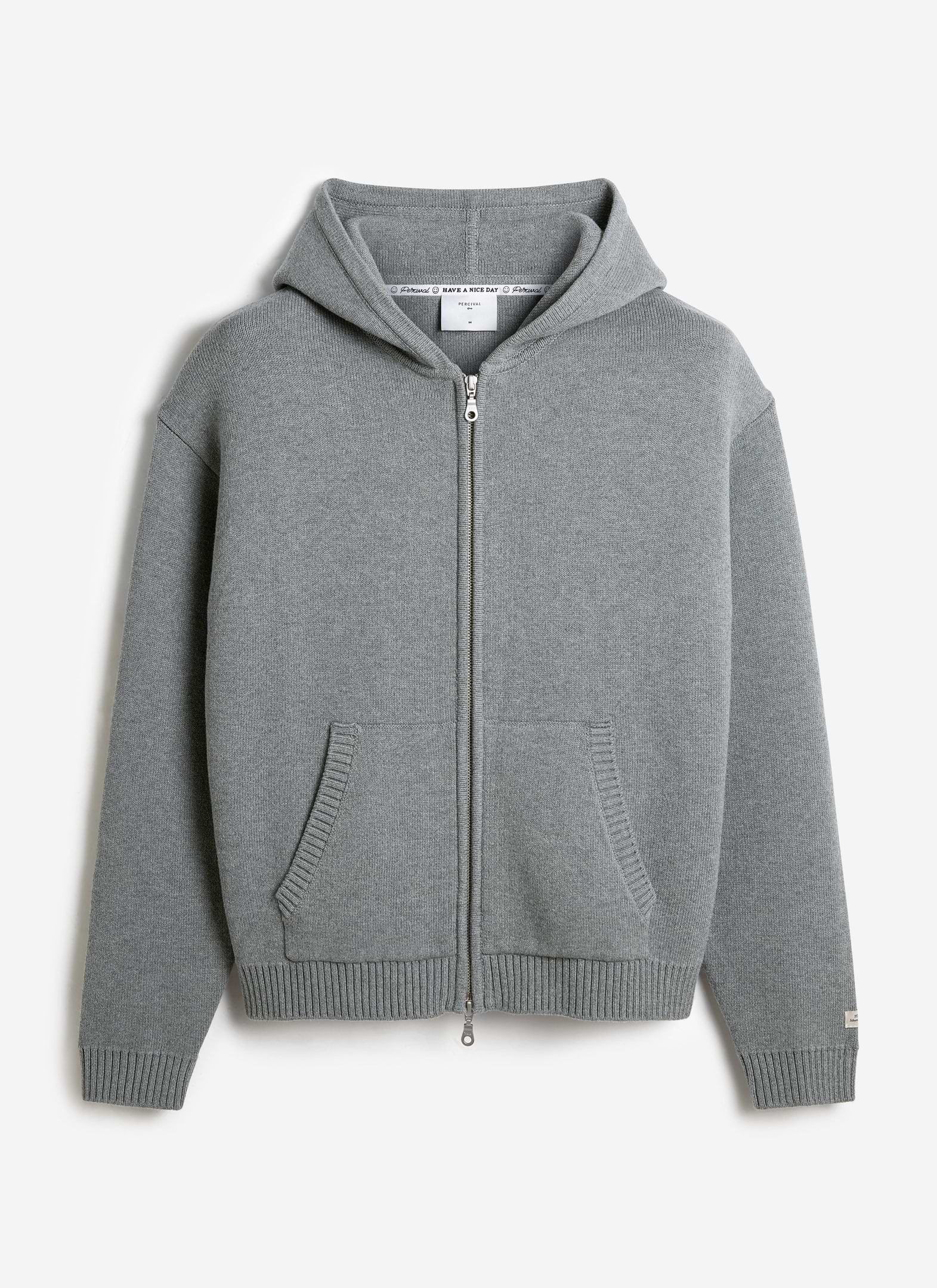 A flat lay of the Percival Chronicle Knitted Hoodie in grey cotton, featuring a zip-up front, hood and kangaroo pockets.
