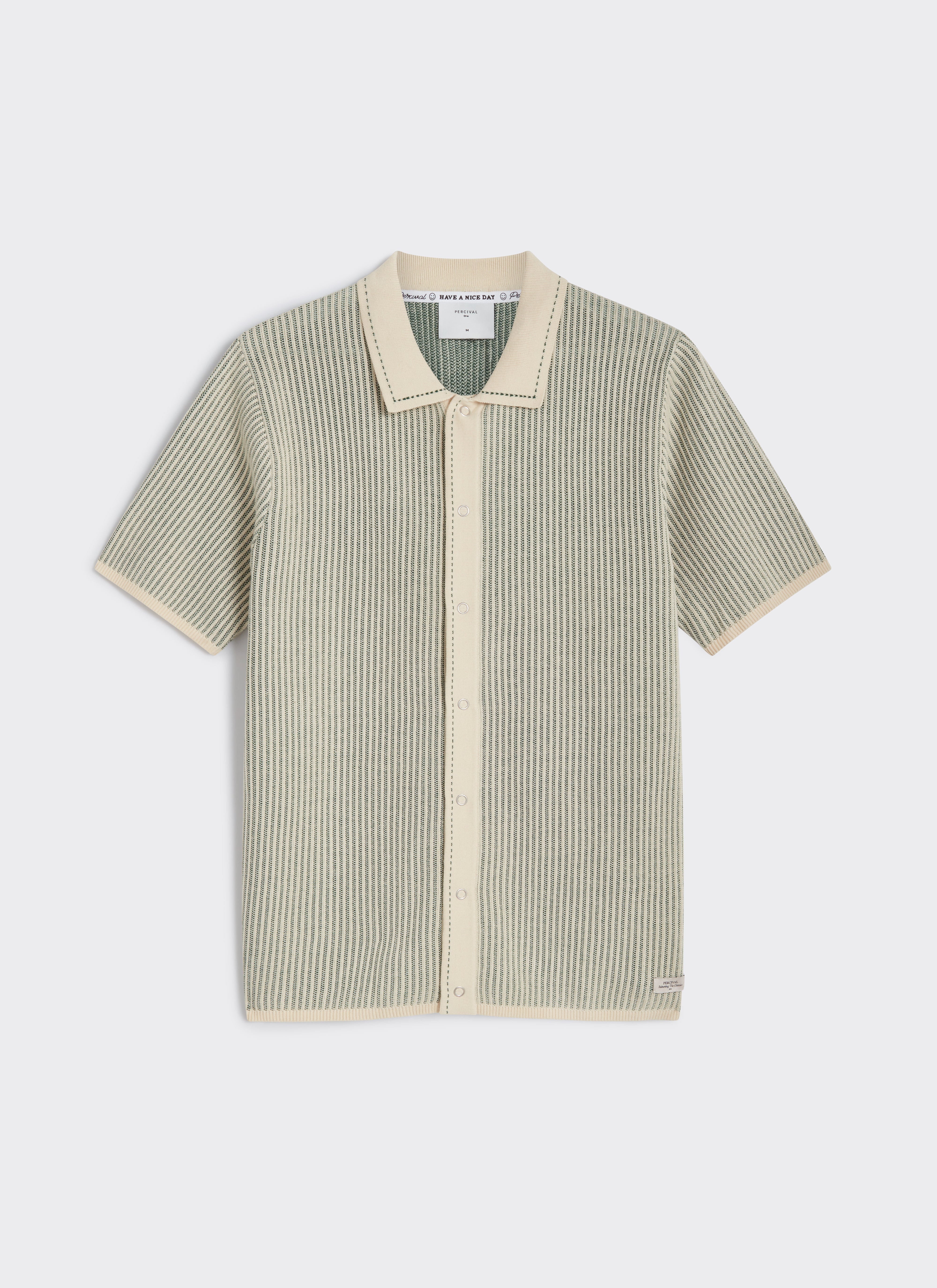 Flat lay of the Percival Dixon Knitted Polo in cream and sage, featuring a vertical stitch and press-stud button front.