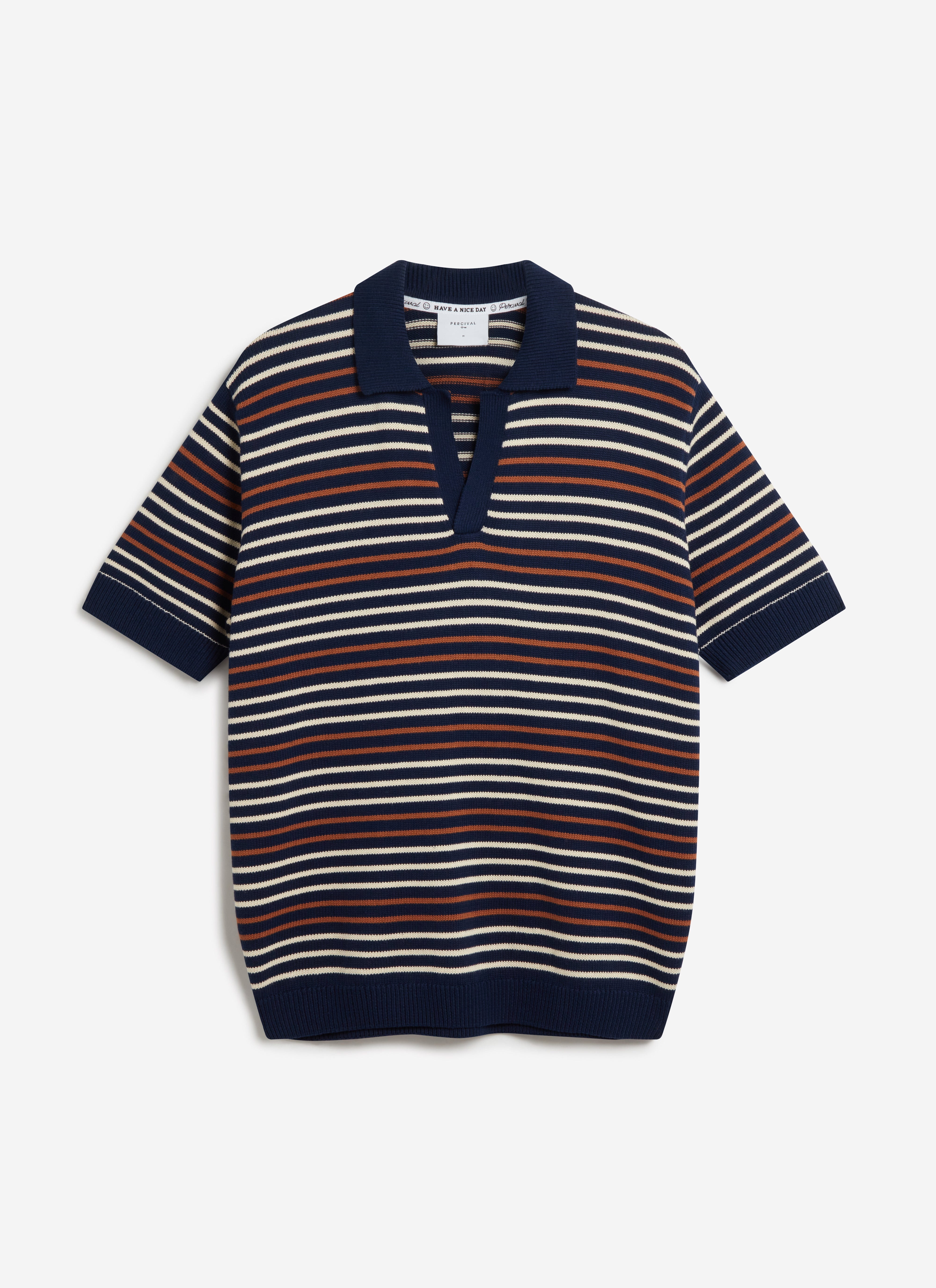 A flat lay of the Percival Douglas Boxy Knitted Polo in navy, featuring an off-white and rust horizontal stripe pattern.