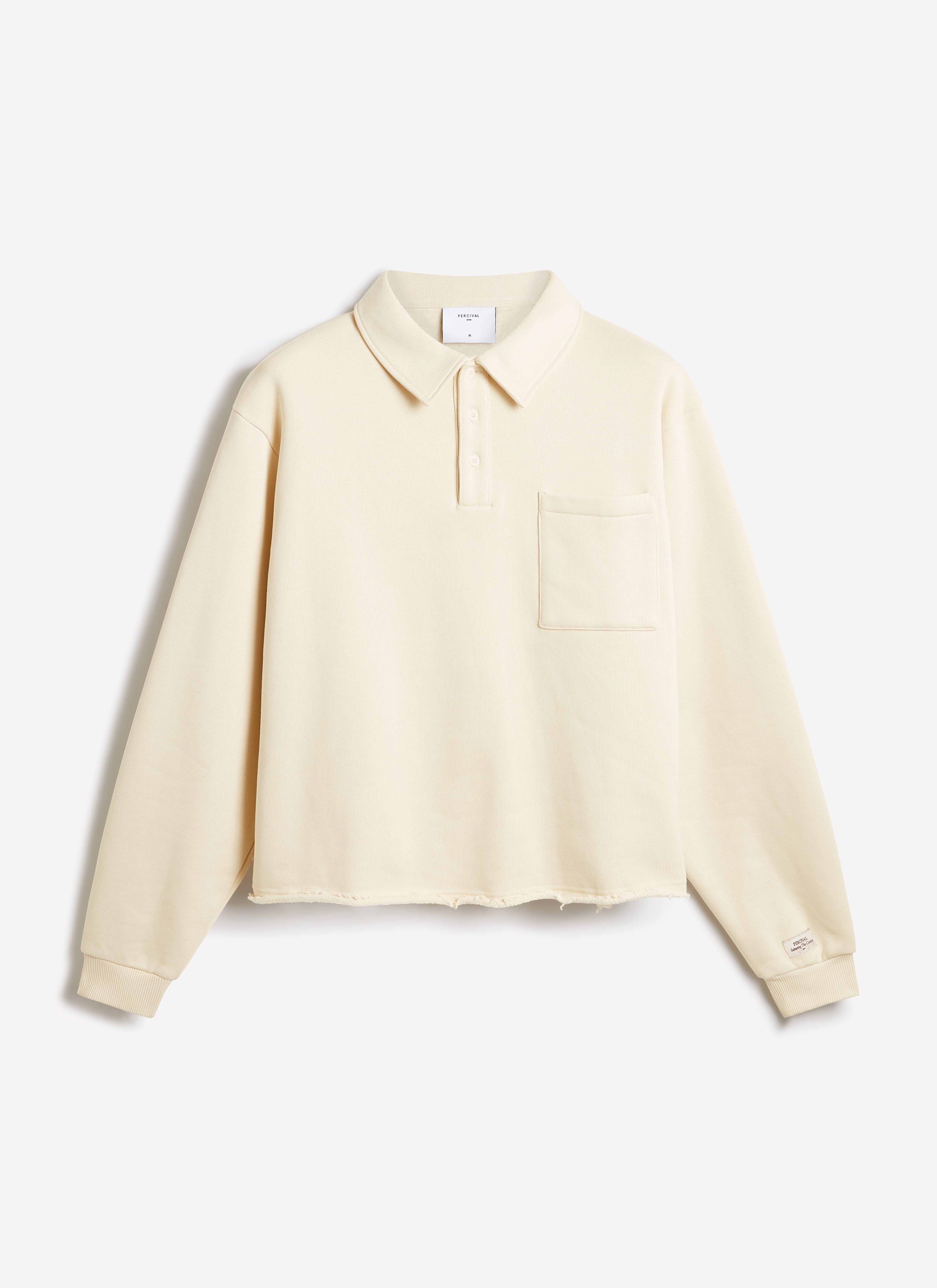 Percival Dudley Boxy Sweatshirt in ecru organic cotton, featuring a polo collar, chest pocket, and raw hem.