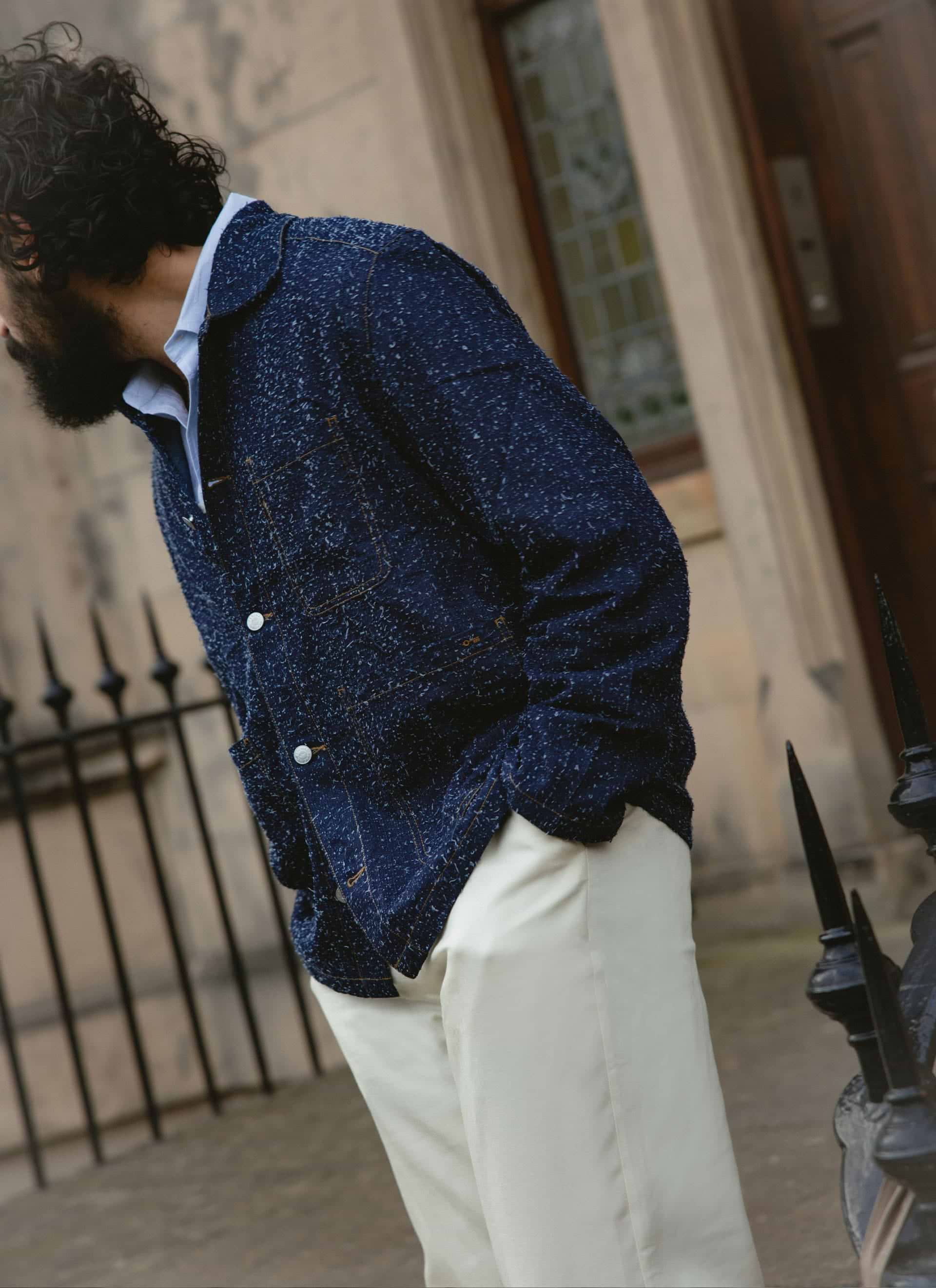 Model in the navy Percival Parsons Chore Jacket, showing the nep flecked cotton texture and contrast stitching.