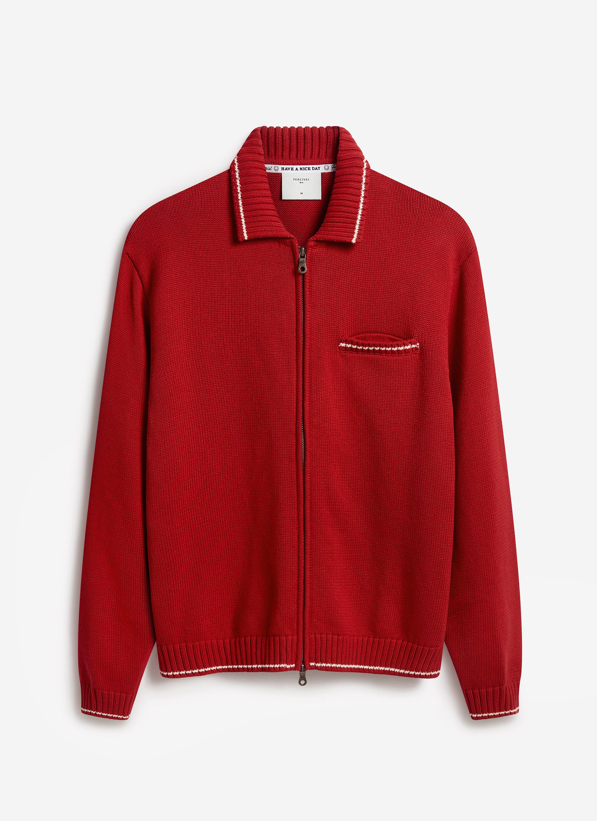 The Percival Gardner Dense Knitted Zip Cardigan in red cotton, laid flat to show its two-way zip and contrast tipping.
